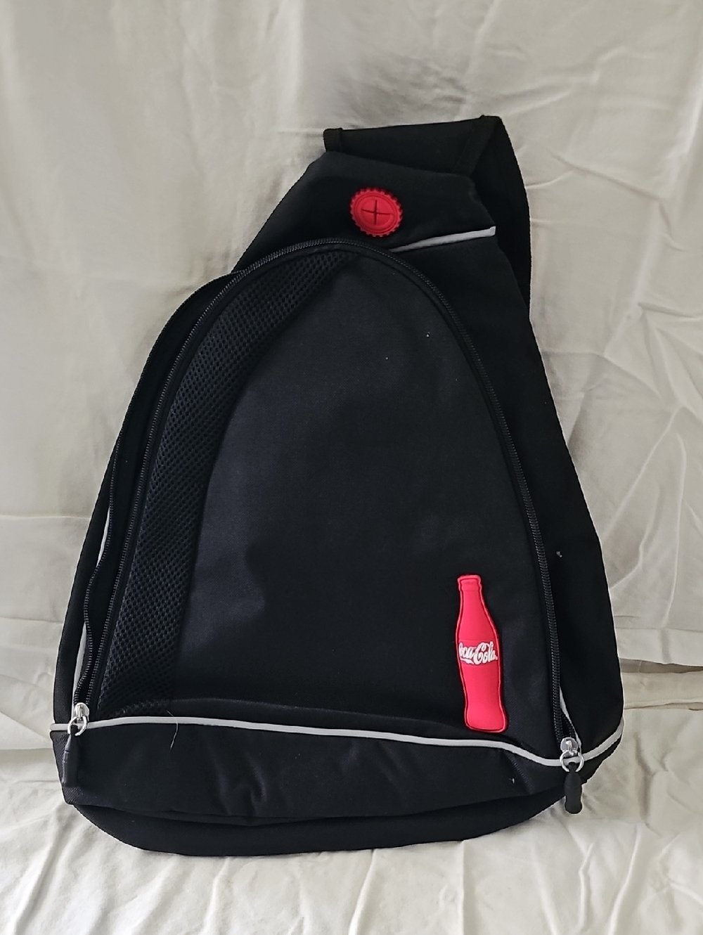 NWOT Coca Cola Black Sling Backpack with Pink Bottle Patch